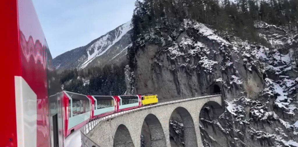 Panoramic view from the Glacier Express train crossing the Landwasser Viaduct.