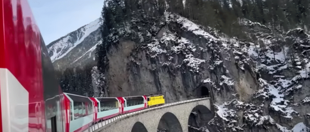 The Glacier Express train winding through the Swiss Alps