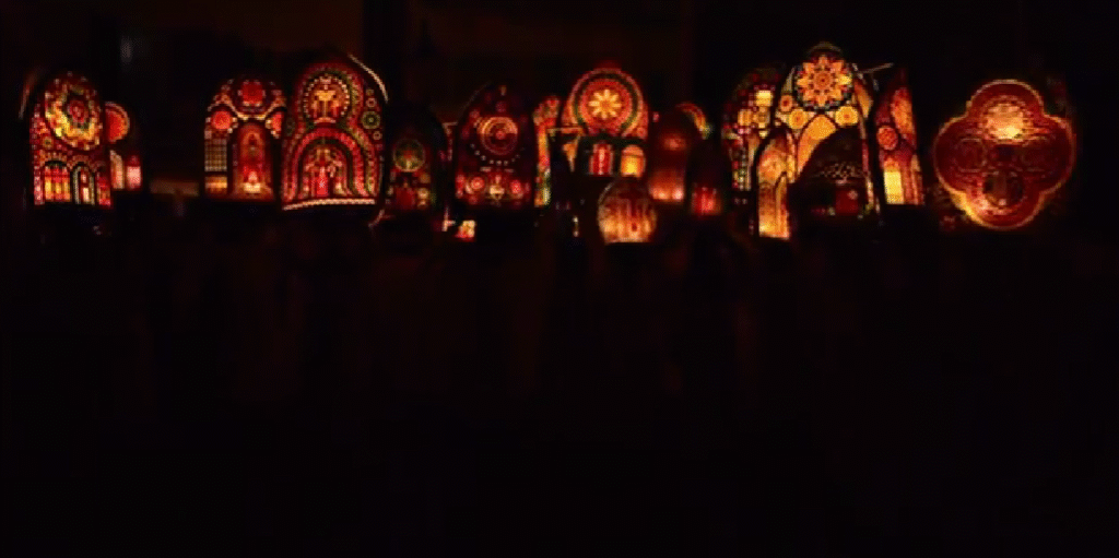 Klausjagen parade in Küssnacht, Switzerland, with participants carrying illuminated Iffele lanterns