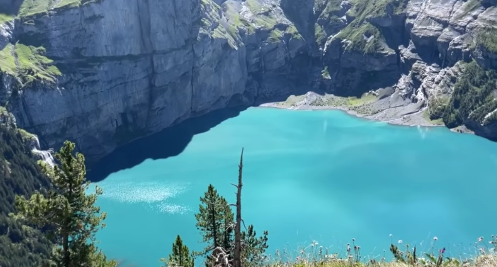 Stunning view of Lake Oeschinen with deep blue waters