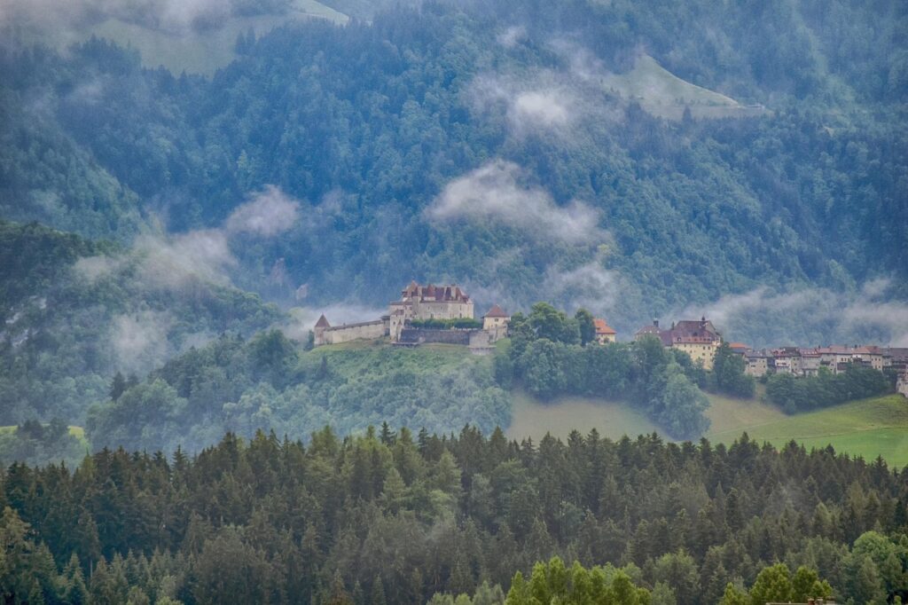 Gruyères Castle shrouded in mist – a magical stop for the best rainy day activities in Switzerland