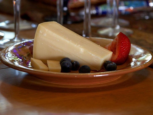 Assorted Swiss cheese served with fresh grapes and strawberries