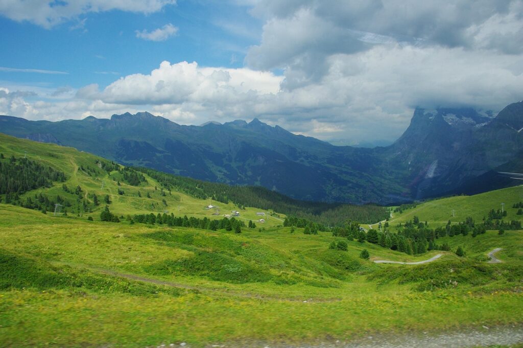Summer hiking near Jungfrau, surrounded by Swiss alpine meadows

