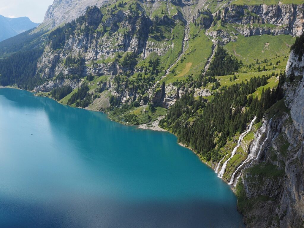 Breathtaking view of Lake Oeschinen, one of the best lakeside walks in Switzerland.
