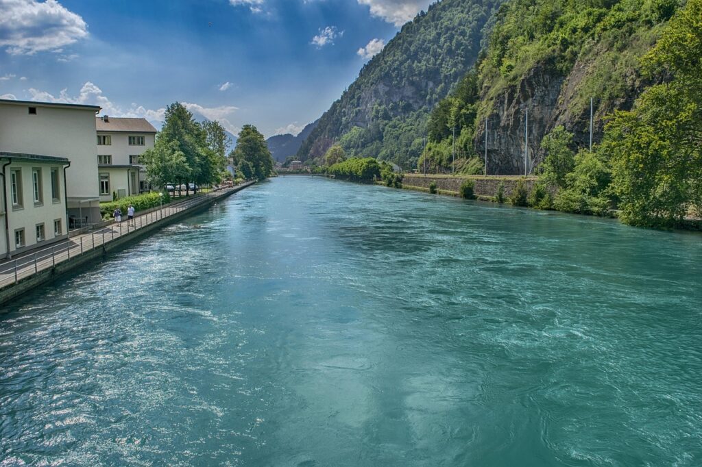 Scenic view of the Aare River flowing through Interlaken, a must-see spot on your perfect trip to Switzerland.