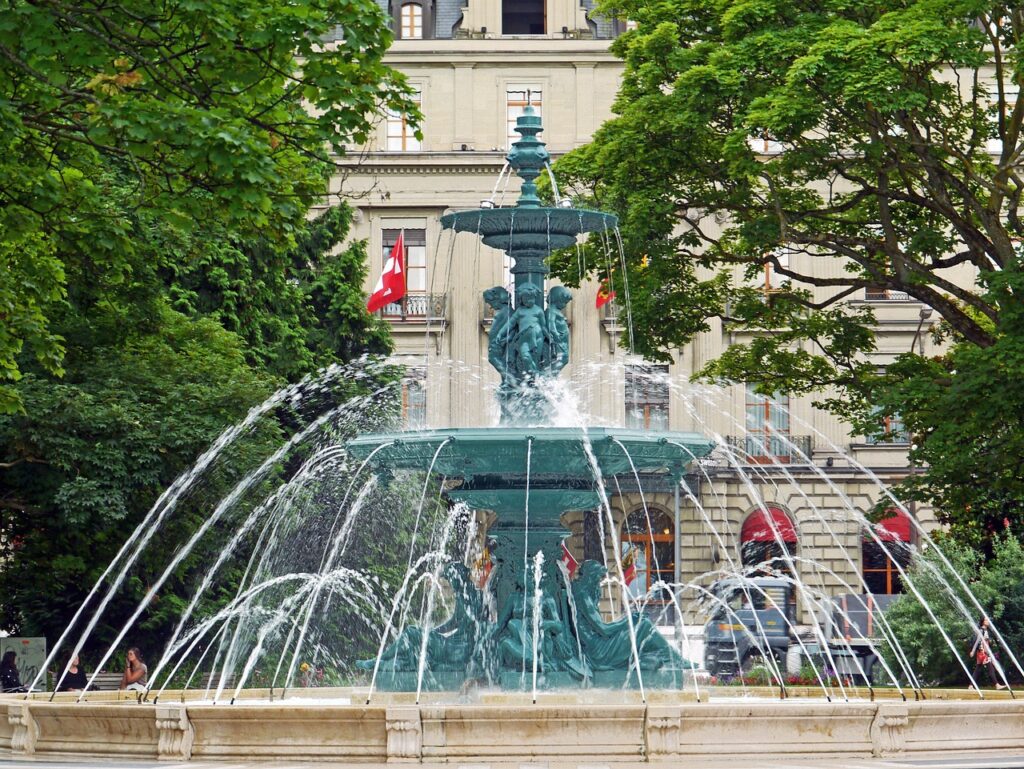 Beautiful fountain in Geneva surrounded by historic architecture