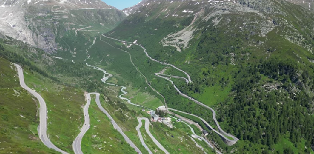 Motorcycle route through Furka Pass and Grimsel Pass in Switzerland, featuring scenic alpine roads, hairpin turns, and panoramic mountain views