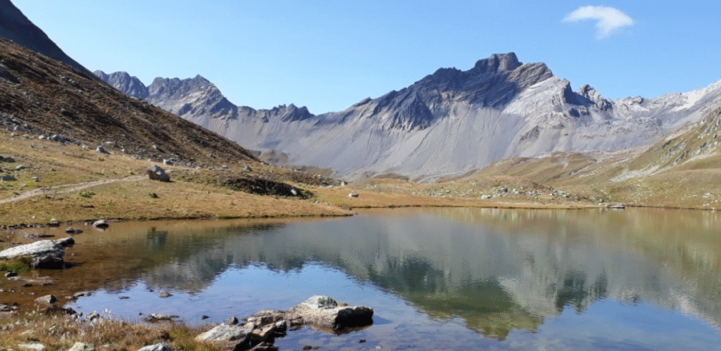 Crystal-clear waters of Lai da Ravais-ch surrounded by untouched nature