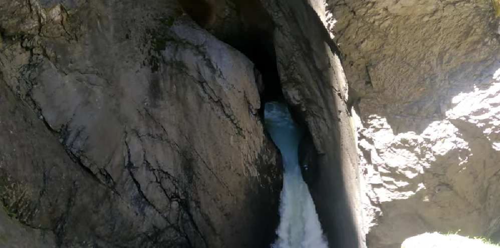 Thundering waters of Trümmelbach Falls flowing inside a mountain in Lauterbrunnen Valley, one of the most unique waterfalls in Switzerland, carved by glacial meltwaters.